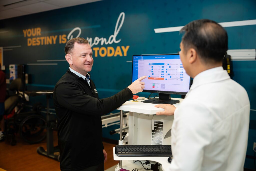 two clinicians discuss technology in the center for innovation at Brooks.