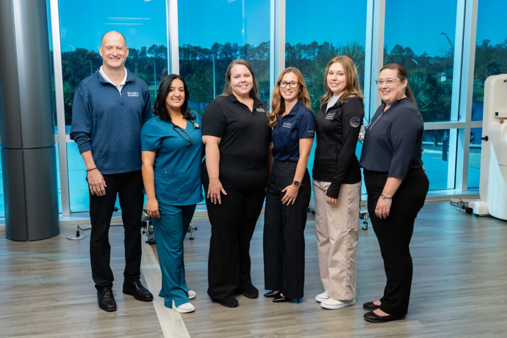 A group photo of clinicians and researchers at Brooks Rehabilitation