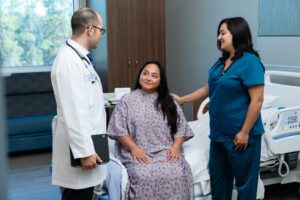 Dr. Galea and nurse with patient