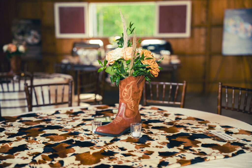 cowboy boot vase on table