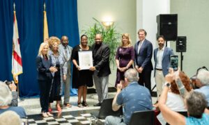Brooks team posing with mayor for Aphasia Proclamation