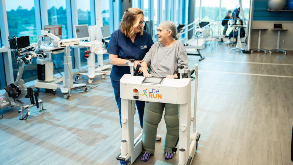 Patient using Lite Run with therapist