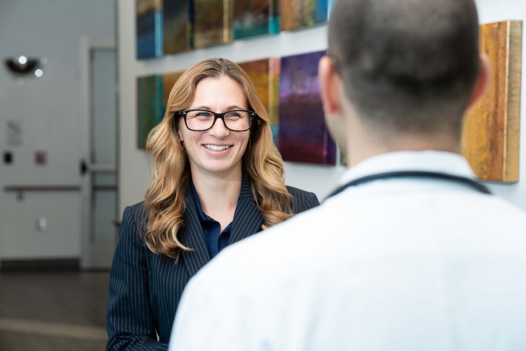 Mindi Manes, director of COAR discusses a project with Dr. Galea, medical director for Brooks' Bartram Hospital.