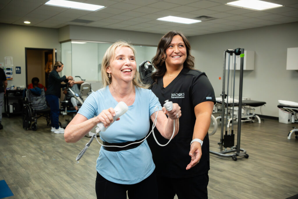 Deborah Plews working with therapist using VR games