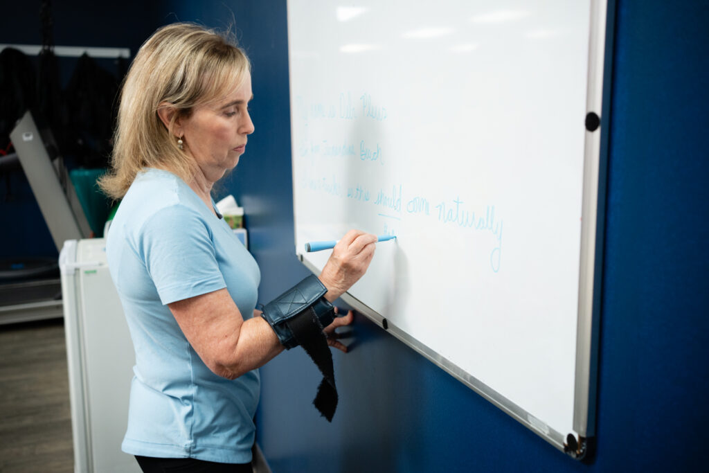 Deborah Plews writing on whiteboard