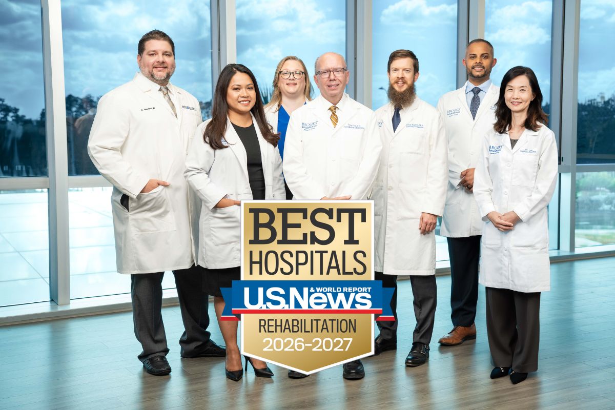 Physicians posing with US News badge